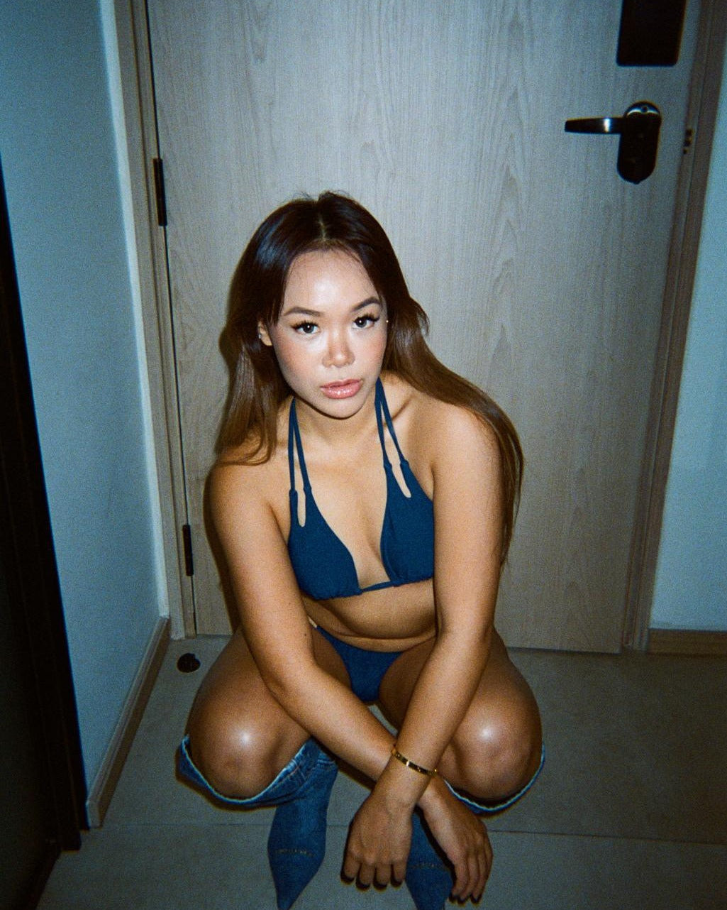 This image features a stylish NAVY bikini set, showcased in a manner that highlights its bold and confident design. The bikini is navy in color, with a minimalist pattern that ensures maximum tan lines are minimized, enhancing the wearer's confidence.