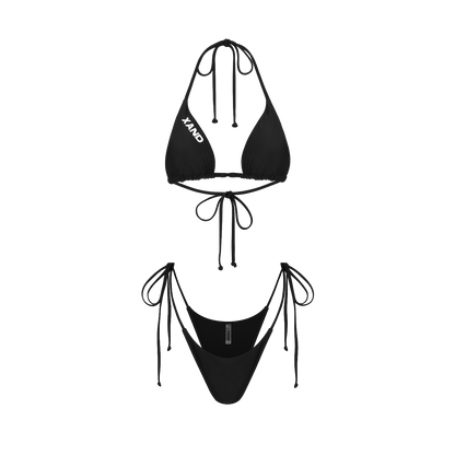 A black bikini with tie-side bottoms and a top designed to enhance the bust, laid out on a plain background.